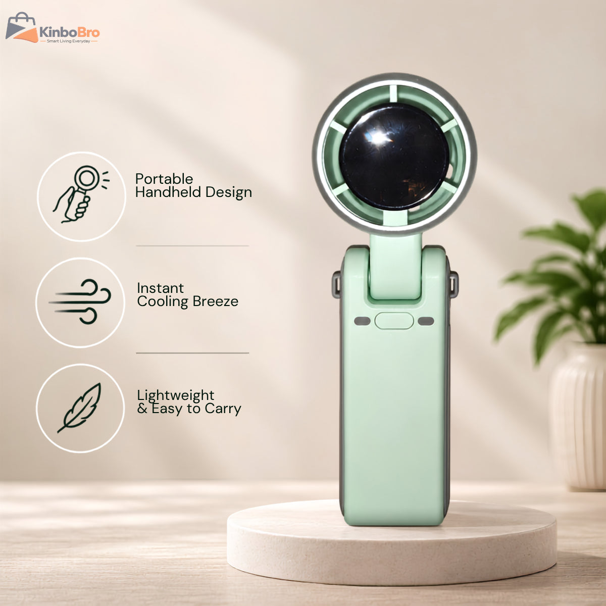 A portable handheld mini fan in mint green stands on a round pedestal. The image includes three feature callouts on the left: 'Portable Handheld Design,' 'Instant Cooling Breeze,' and 'Lightweight & Easy to Carry,' with a blurred indoor plant in the background.